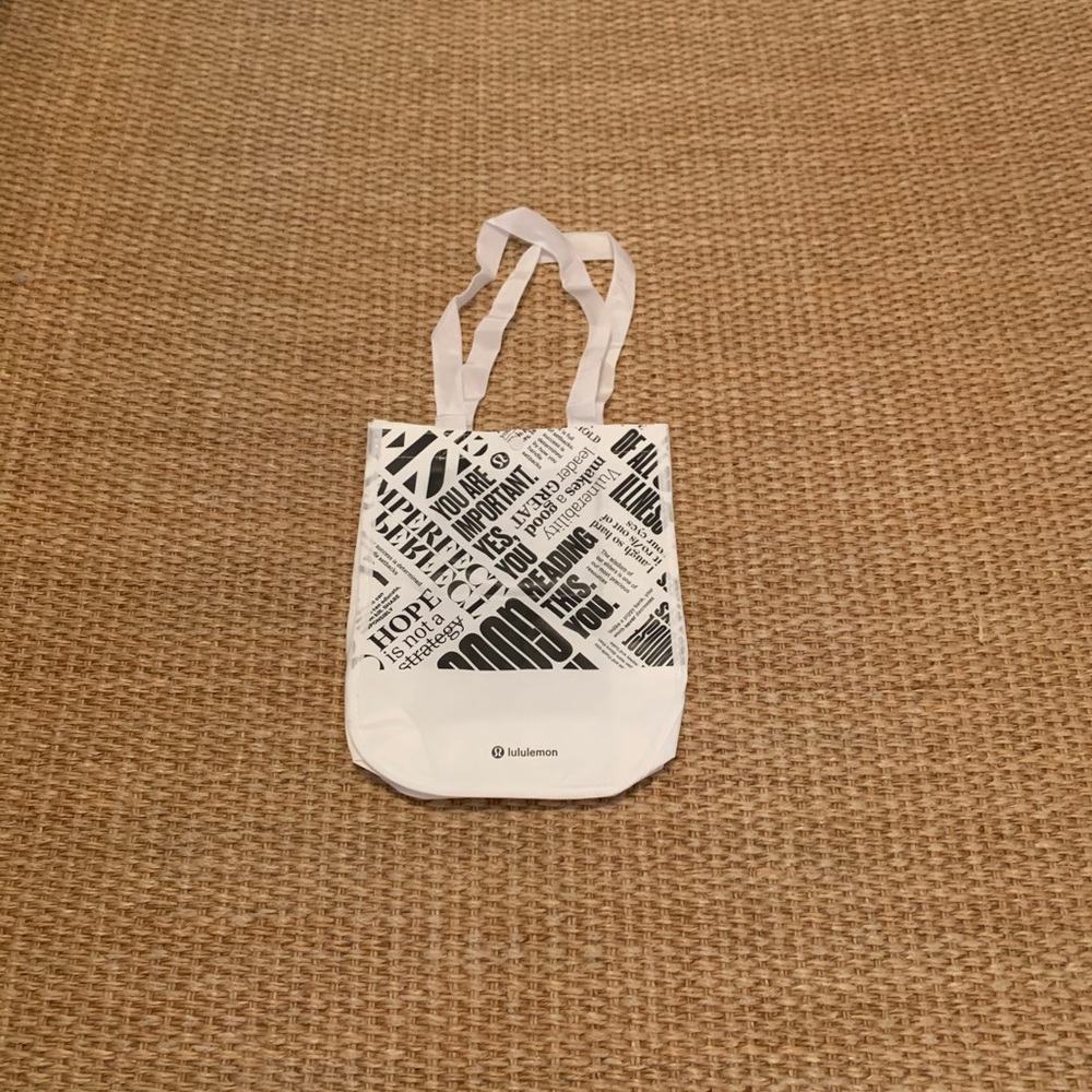 White and black lululemon shoulder bag.